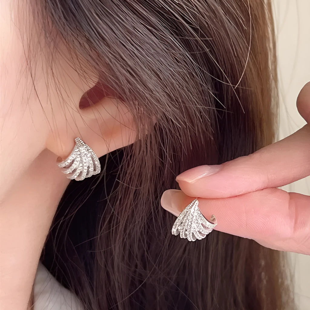 Geometric zircon earrings with platinum electroplated finish and line design details