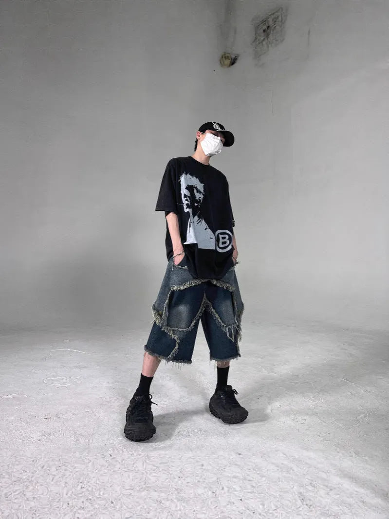 Men's blue retro denim shorts with frayed hem and five-pointed star design, loose fit with knee-length styling