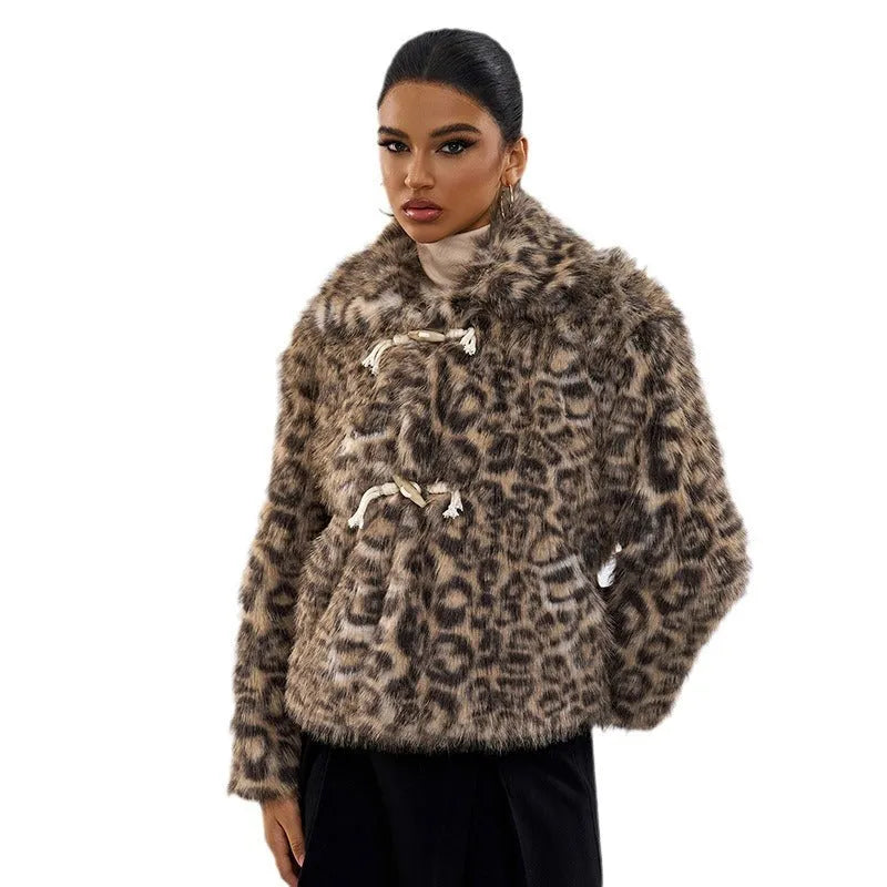 Women's leopard print coat with a buckle lapel and regular sleeves.