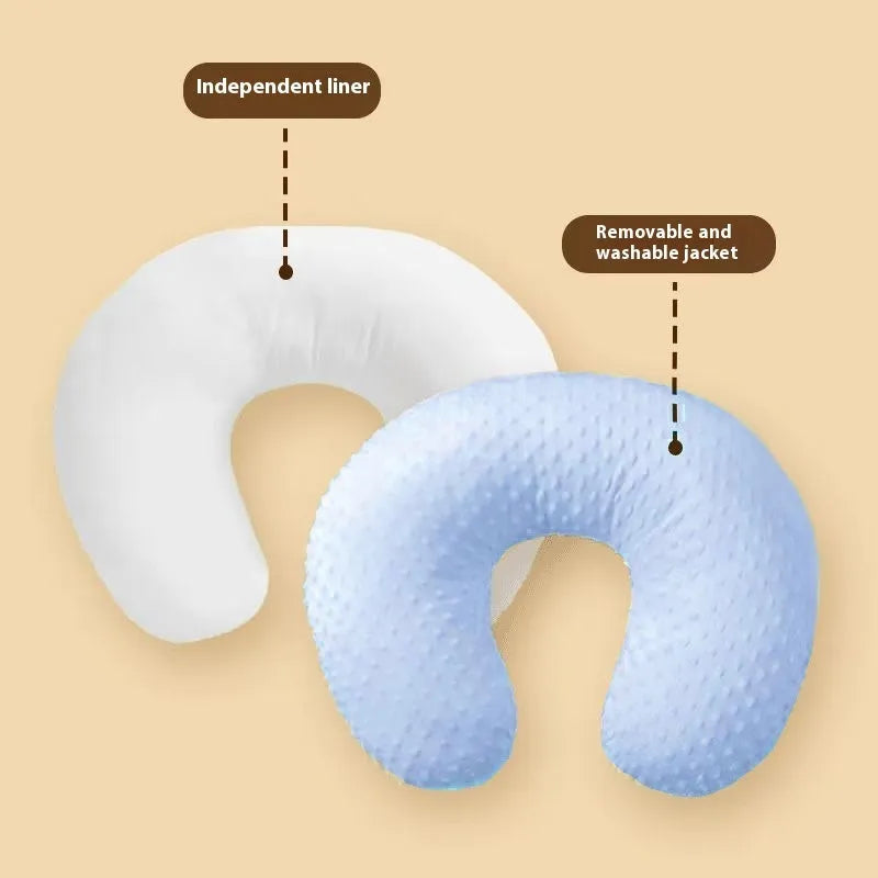 Multifunctional nursing pillow in light blue colour for breastfeeding support and spill prevention.