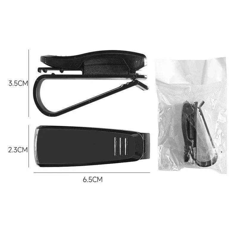 Black plastic car sun visor clip holding sunglasses and cards, measuring 6.5cm by 2.3cm