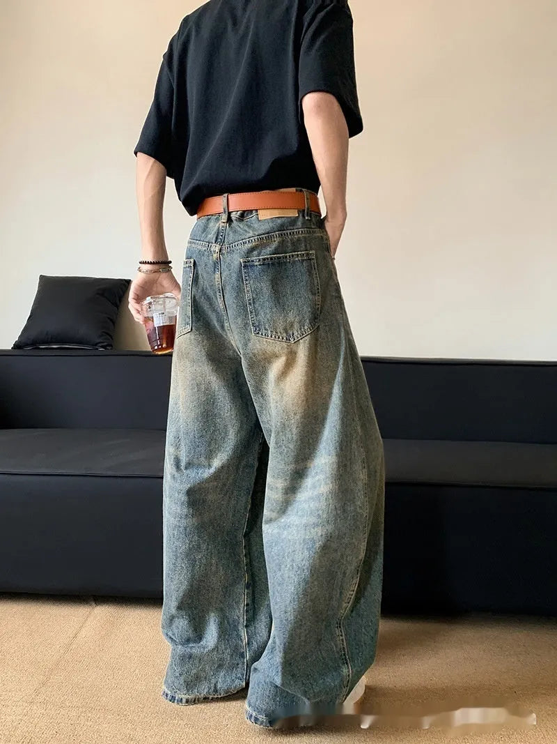 Men's retro blue distressed wide-leg denim trousers with machete styling detail