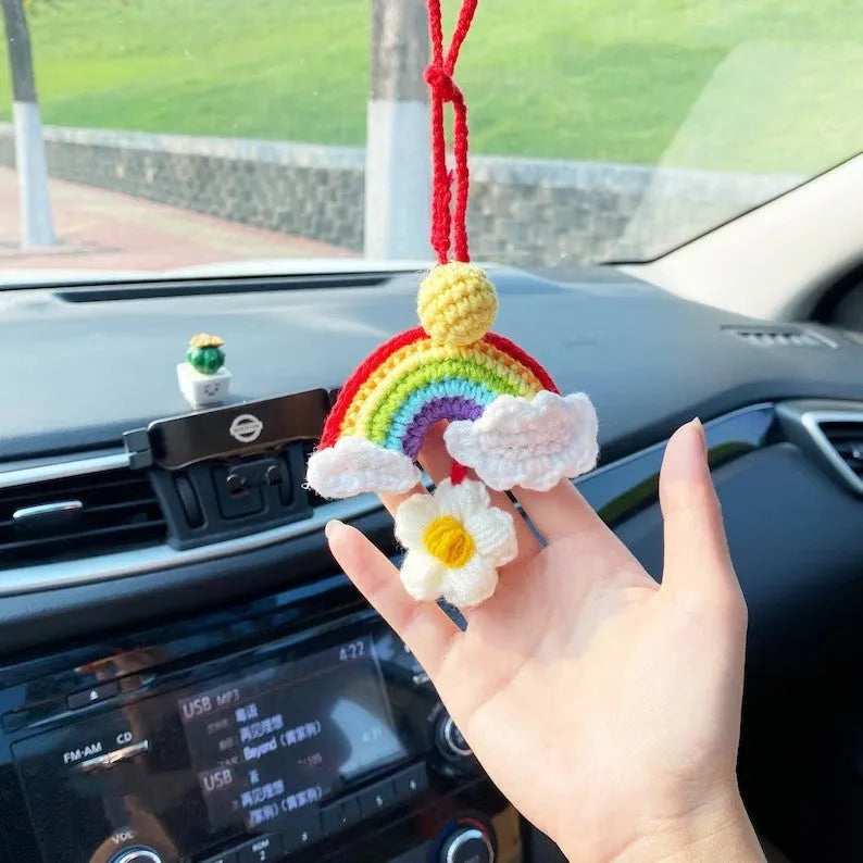 Handmade crocheted avocado-shaped and rainbow pattern car pendants made from wool yarn.