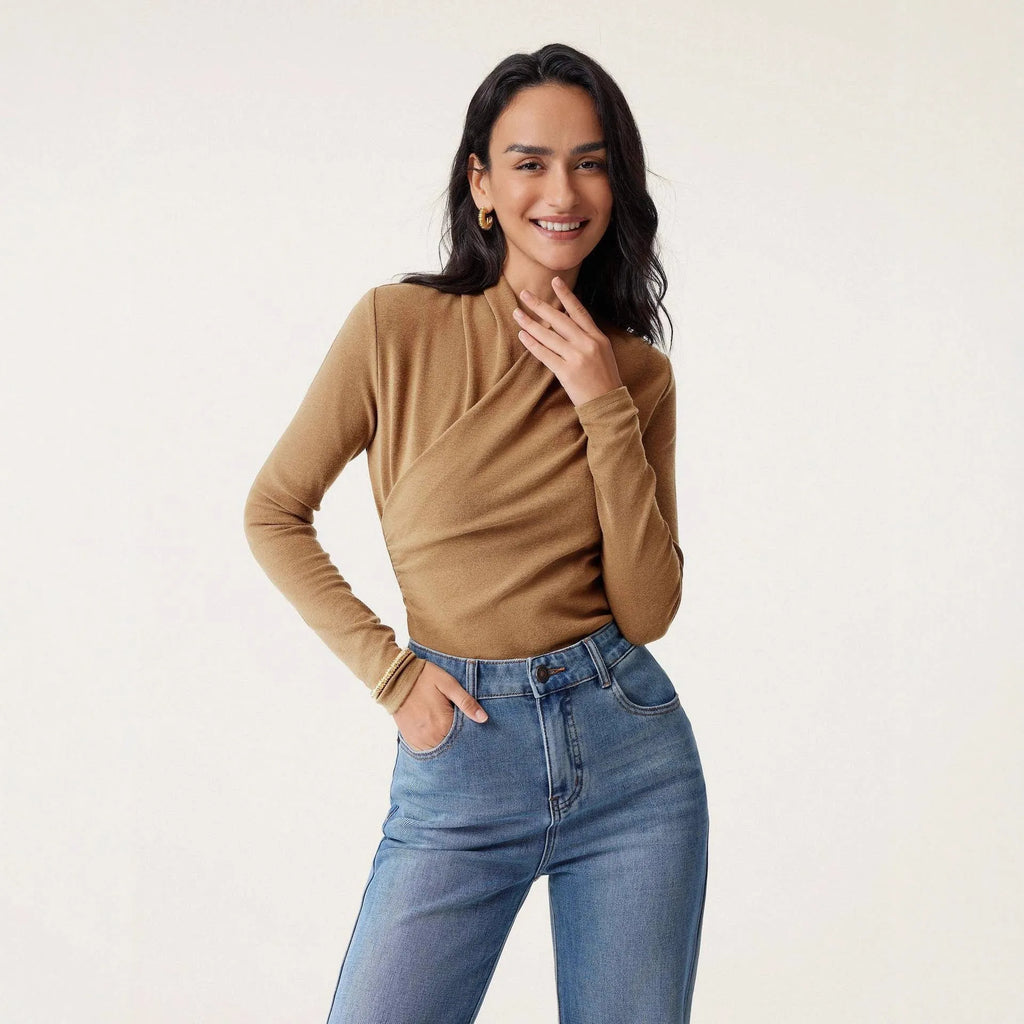 Camel-coloured slim fit women's long sleeve pullover sweater on a hanger.