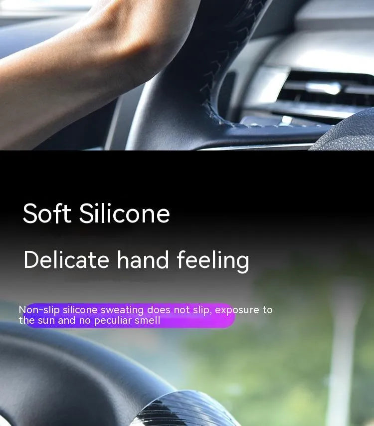 Black and blue silicone steering wheel assist ball with metal bearing, shown at approx 9x6 cm.