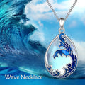 Blue heart-shaped alloy pendant necklace on a chain.