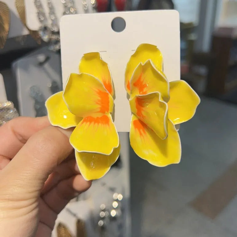A pair of pastoral style flower stud earrings with an oil-spot glaze finish in an alloy setting.