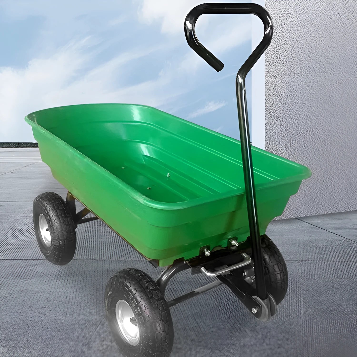 Green four-wheel steel and plastic dumptruck with a large hauling bed.