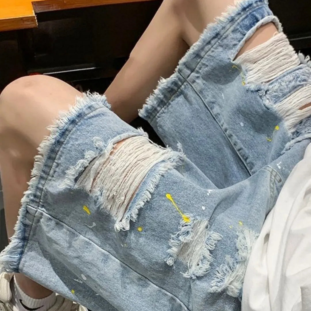 Men's loose fit water washed hole denim shorts in light blue with street style summer design