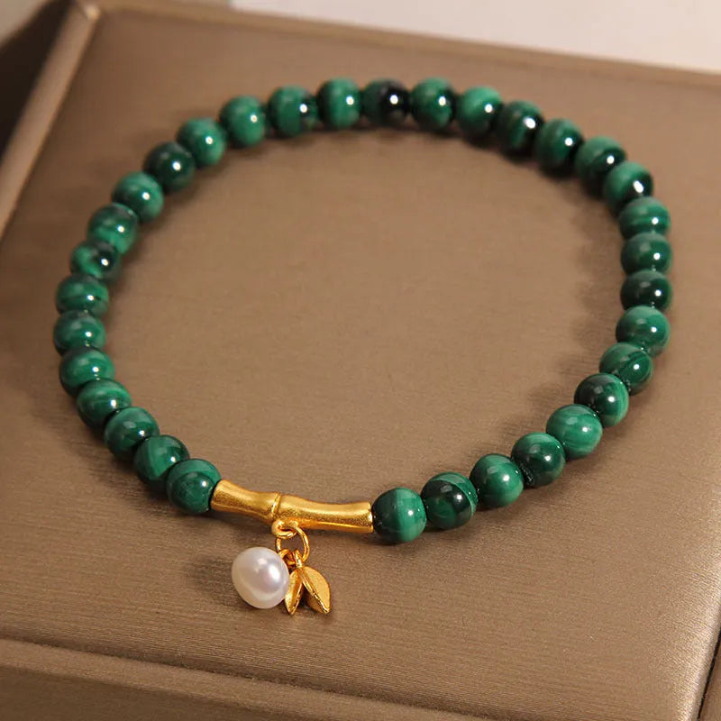 Women's adjustable white crystal bracelet with lucky bamboo charm in high-rise setting