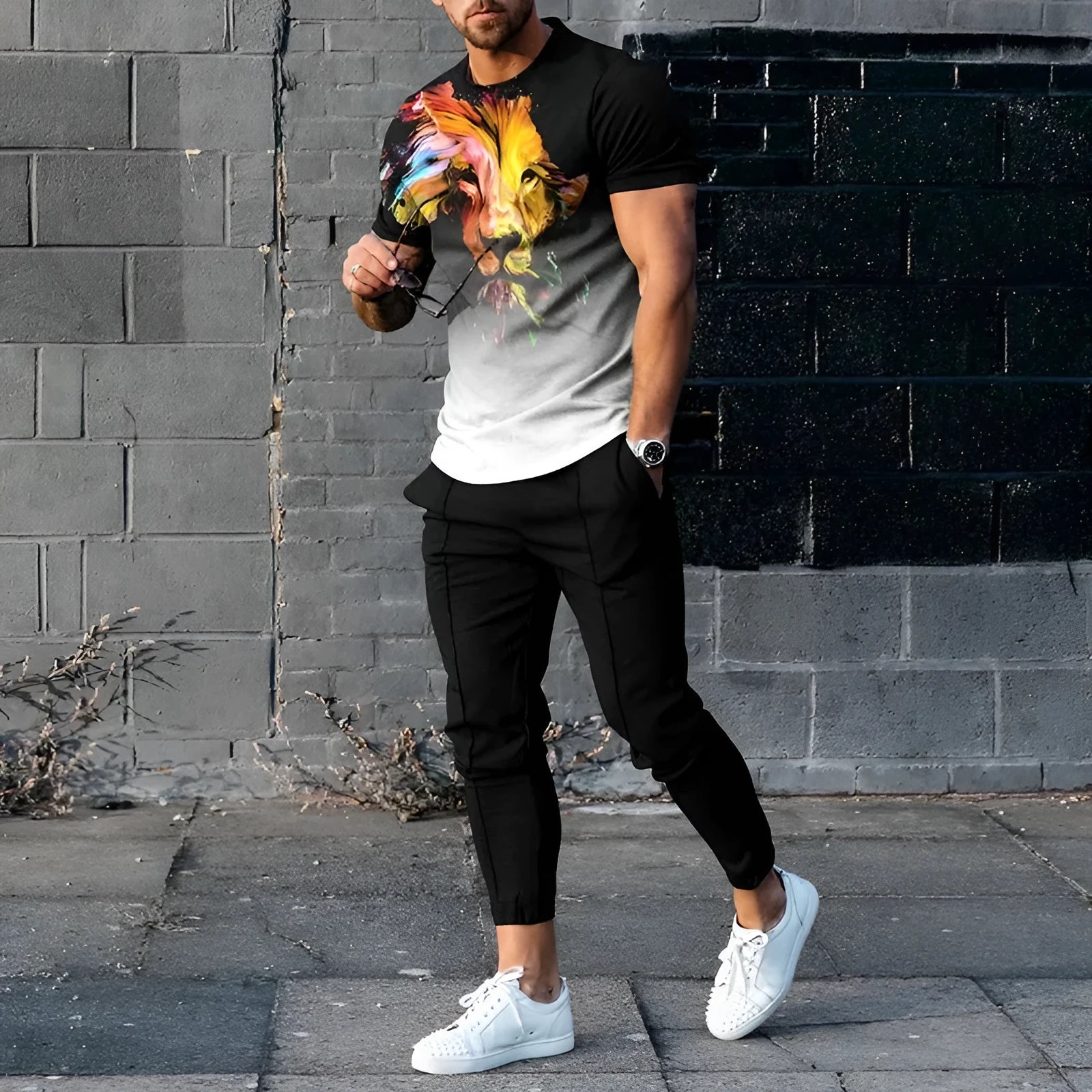 Men's short sleeve printed T-shirt and matching trousers sport suit set on a hanger.