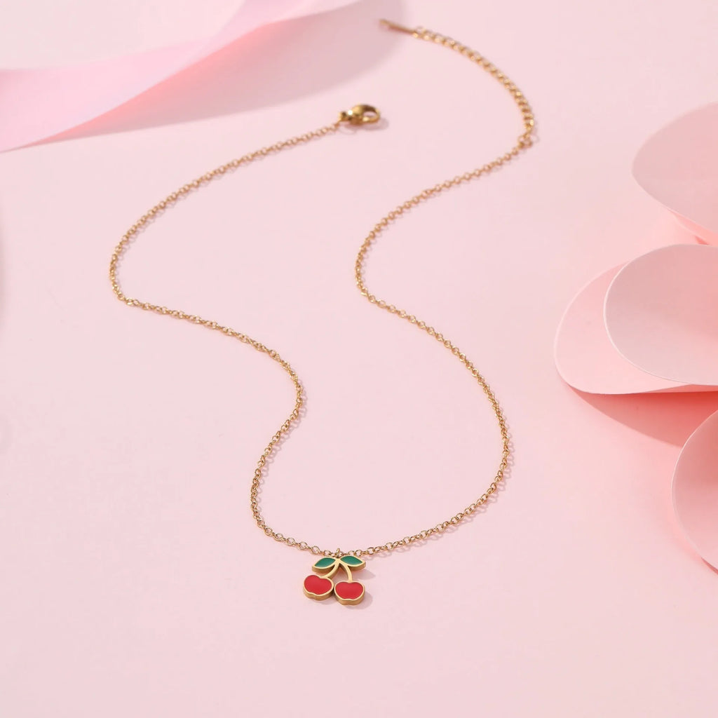 Cherry jewellery set showing necklace, bracelet, earrings, and ring in stainless steel with cherry design