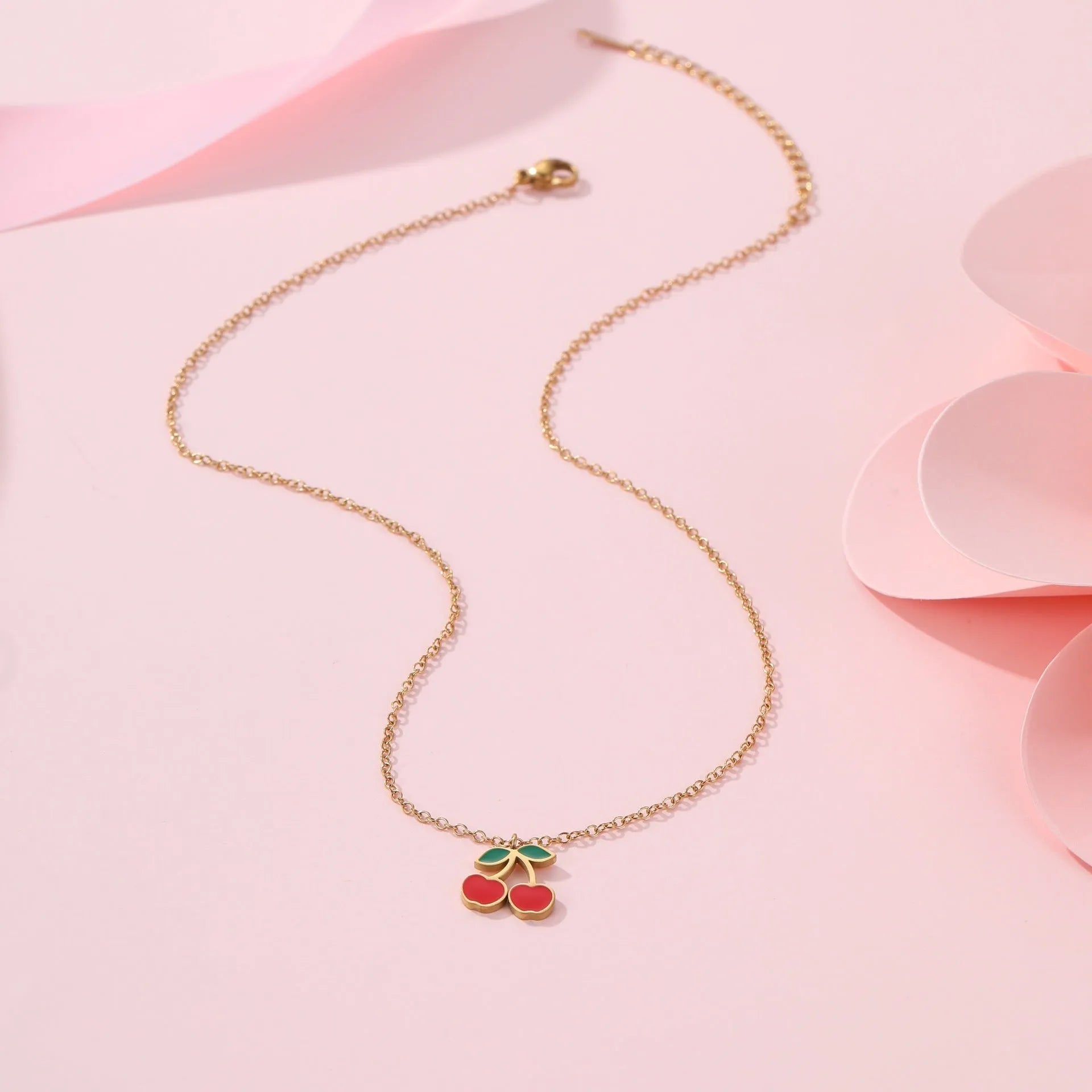 Cherry jewellery set showing necklace, bracelet, earrings, and ring in stainless steel with cherry design