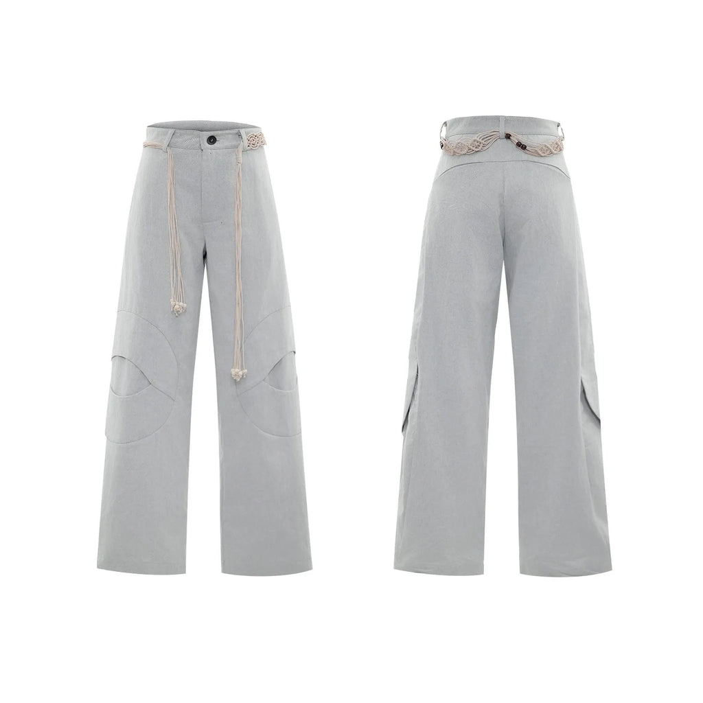 Men's dark blue cotton straight-leg jeans with loose fit, showing heavy 3D cutting, belt stitching, and decorative zip details.