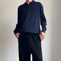 Pure wool polo neck sweater with lapel collar in loose fit, shown in milky white.