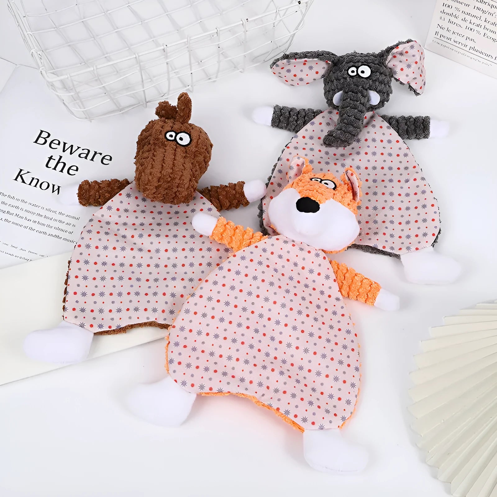 Brown, grey, and orange velvet pet stuffed toys in fox and elephant designs with crinkle sound paper inside.
