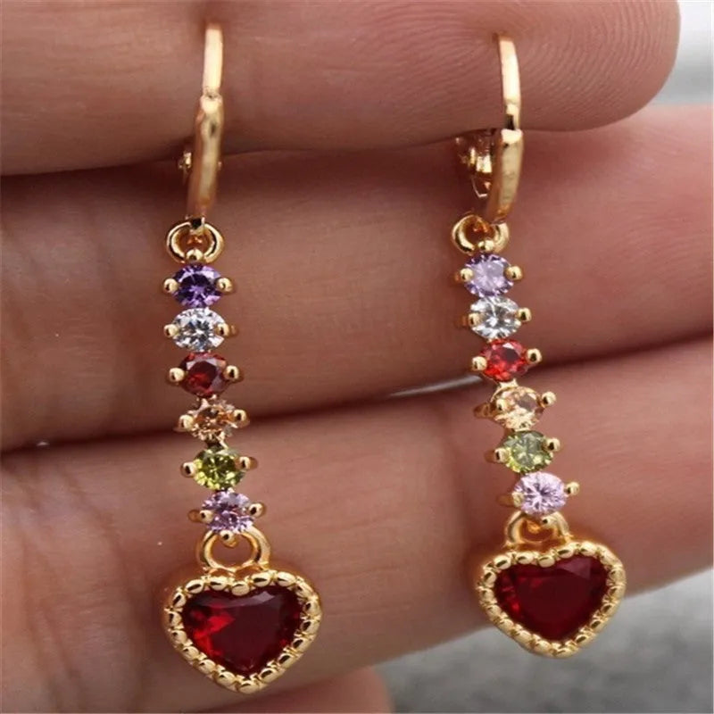 A pair of gold-coloured heart-shaped metal earrings for women.