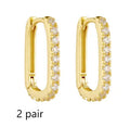 S925 sterling silver oval zircon ear clips on ear, shown in yellow and white colour options.
