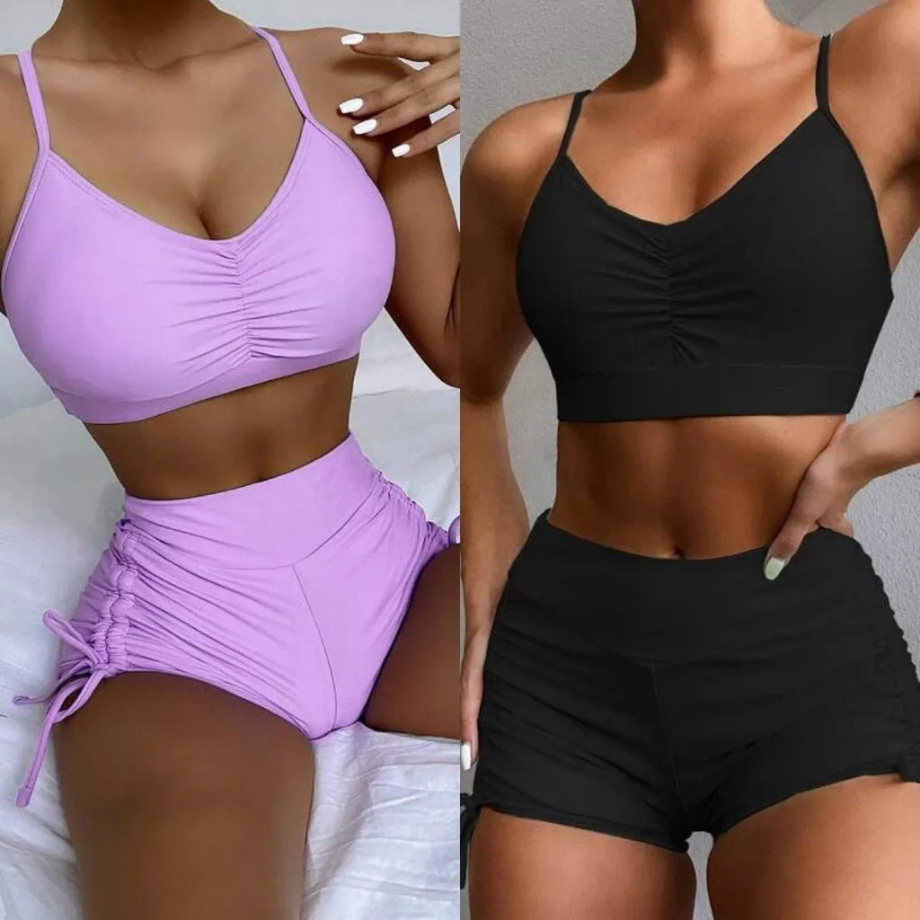 Women's black high-waist bikini swimsuit with split-side shorts and brief top.