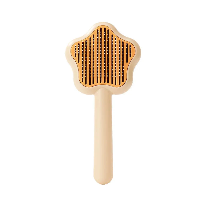 Green self-cleaning stainless steel cat comb with needle teeth on a 20cm handle.