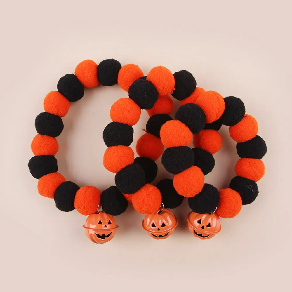 Orange and black pumpkin-themed adjustable cat collar for Halloween costumes.