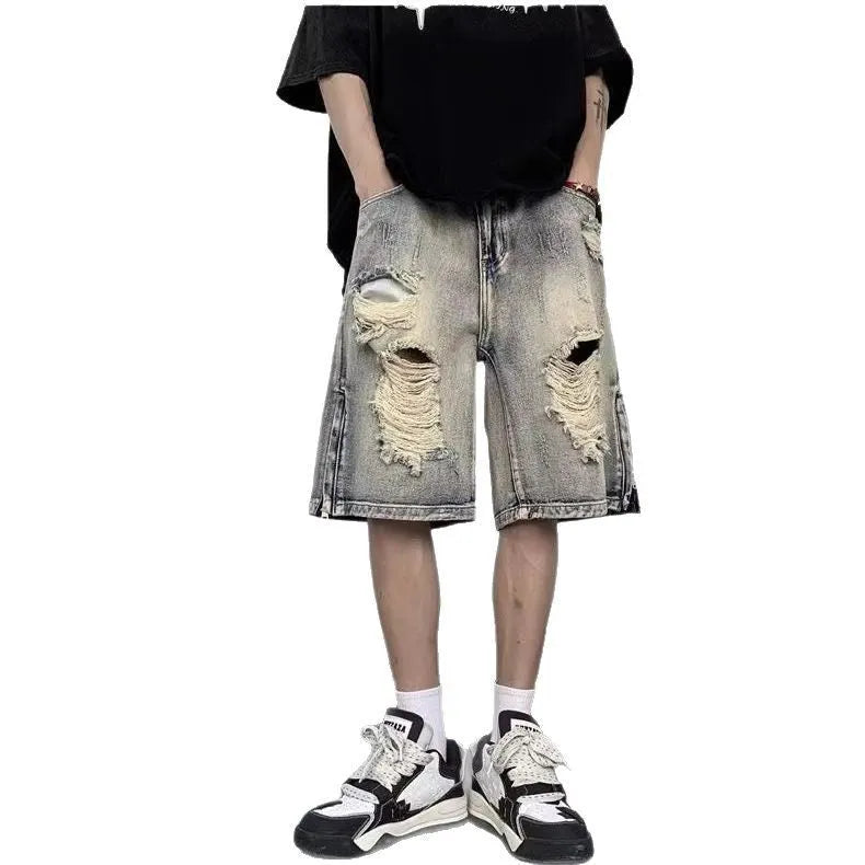 Blue retro tattered denim shorts with wide leg cut on mannequin
