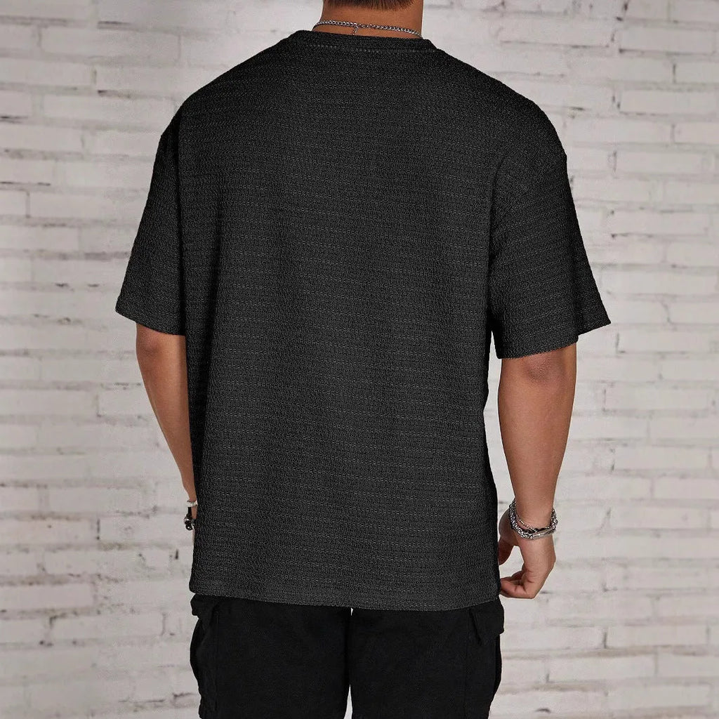 Men's slim fit polyester t-shirt in loose hollow construction showing round neck and short sleeve design