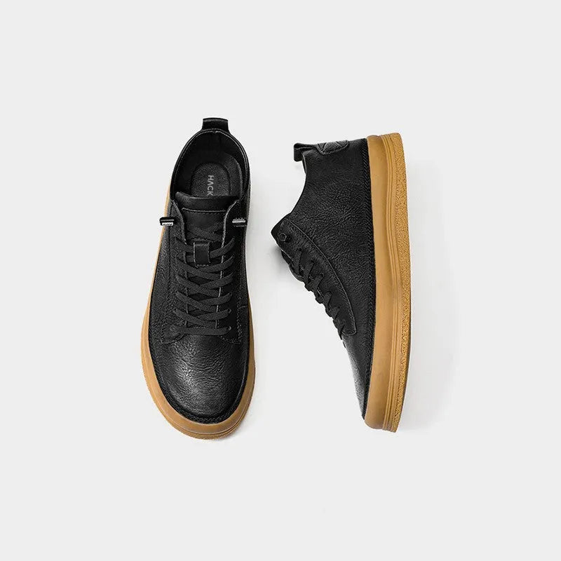 Men's black leather casual shoes with round toe, flat heel, and lace-up closure on rubber sole