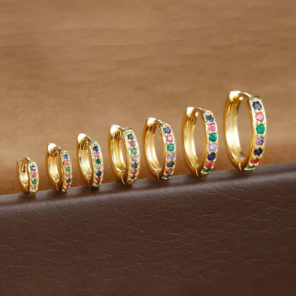 Women's circle zircon perforated stud earrings in gold, rose gold, and silver colour options showing geometric design
