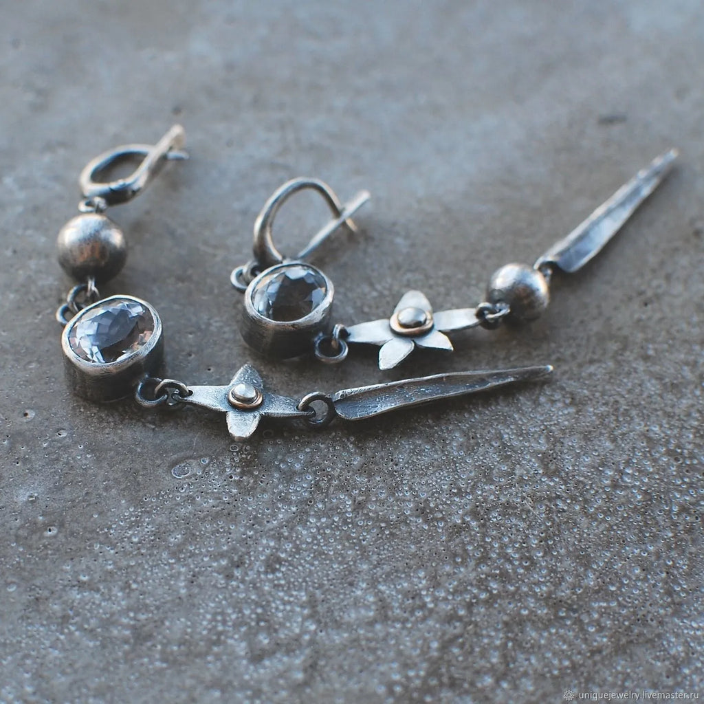 Geometric long pendant earrings with XINGX design and rhinestones in antique silver