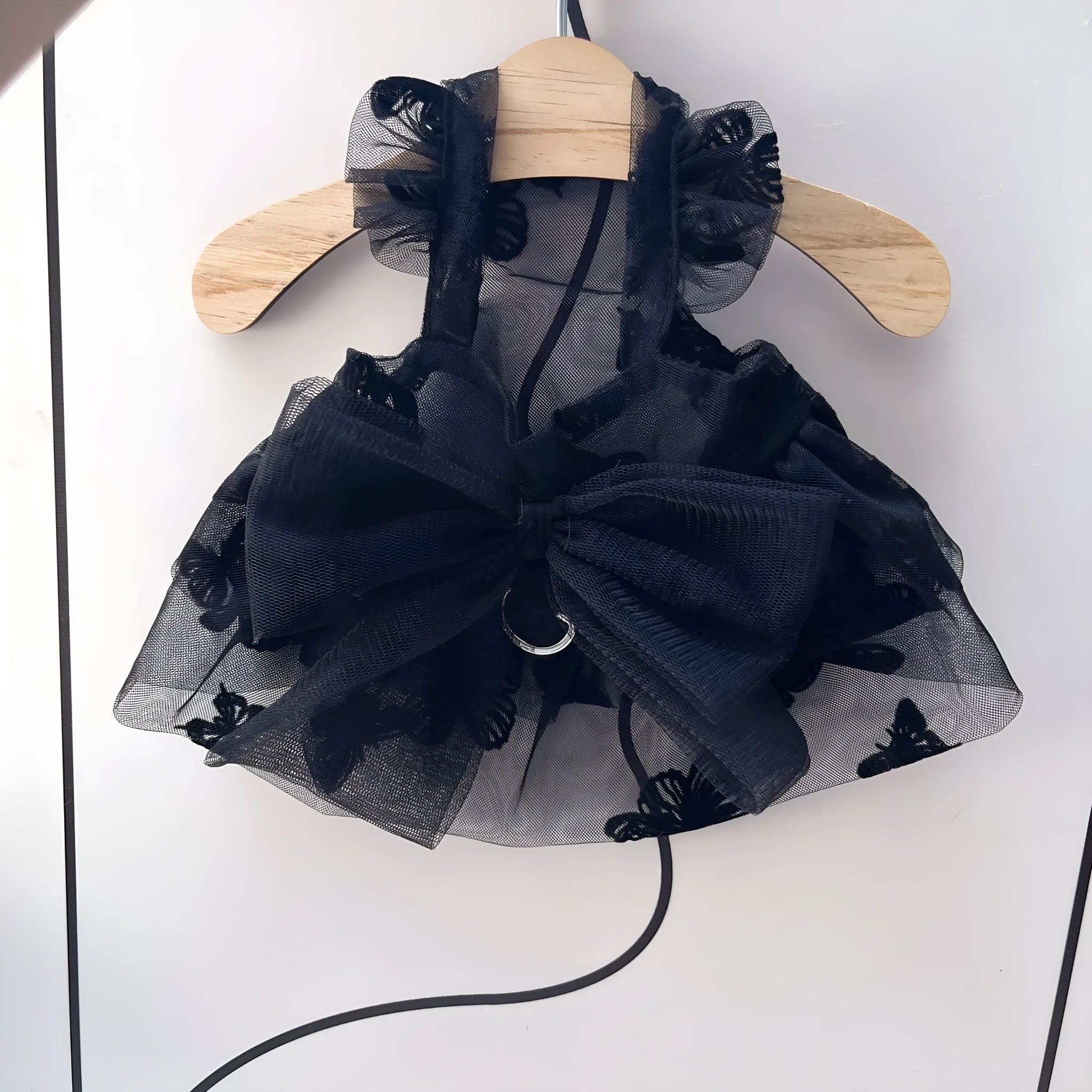 Black gauze princess tulle skirt for a small dog or cat on a white background.