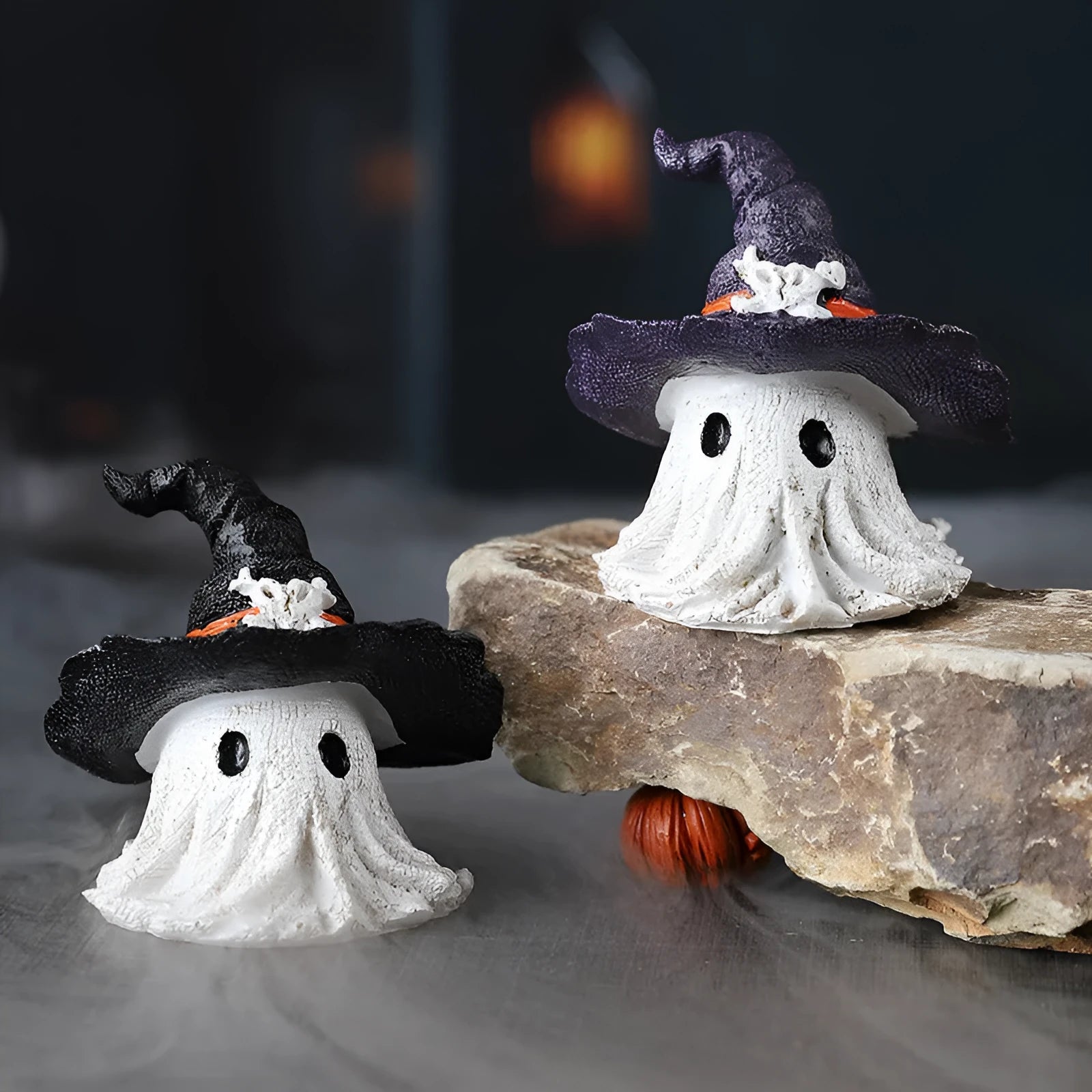 Resin wizard hat ghost ornament in kid-sized dimensions available in black or purple colour options