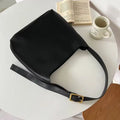 Women's soft PU leather shoulder bag with swing threads design in black or brown, showing 28x32x12cm dimensions