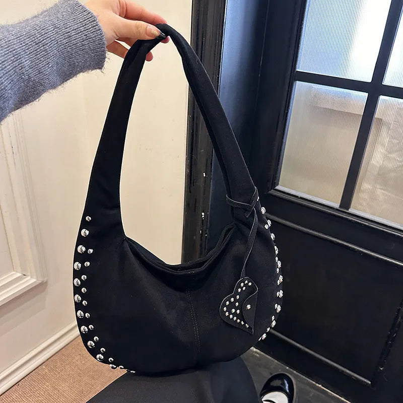 Soft plush retro style women's handbag in strapless tote design showing colour options