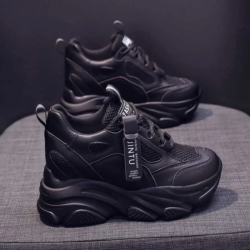 Women's black mesh platform casual shoes with toe holder design on a white background.