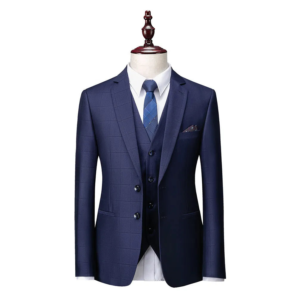 Men's navy blue plaid slim fit three-piece suit with vest, jacket, and trousers on a hanger.