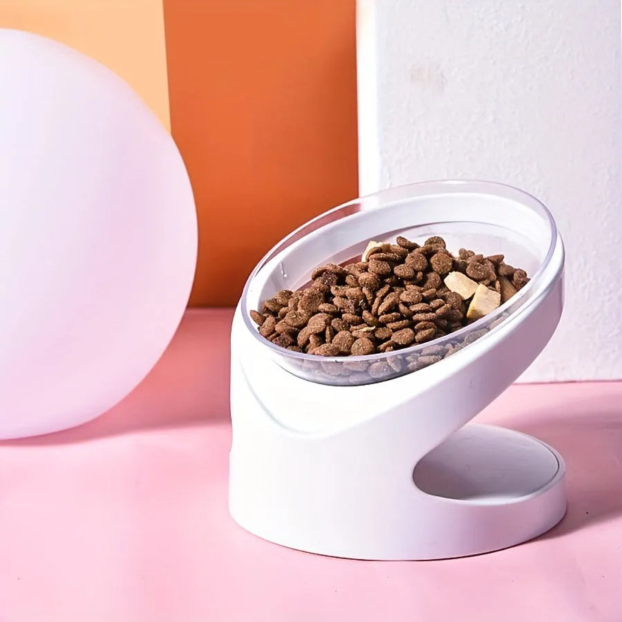 White elevated tilted plastic cat food bowl for ergonomic feeding.