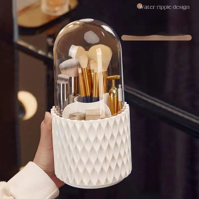 White rotating transparent makeup brush storage box with lid on desktop