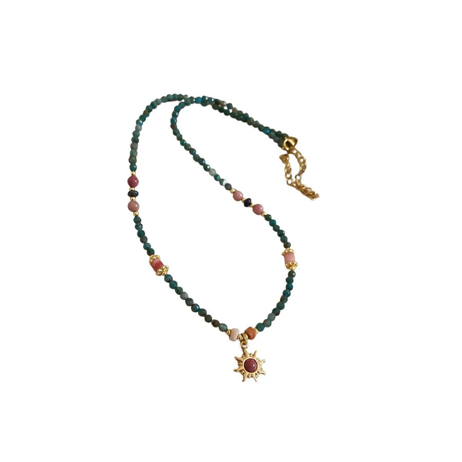 Freshwater pearl necklace with a geometry-shaped stone sun pendant on an electroplated chain.