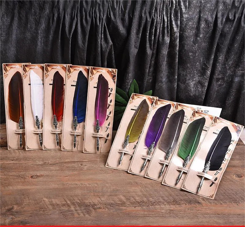 Vintage feather dip pen with zinc alloy shell in various colour options on a desk.