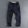 Men's khaki cotton work trousers with straight leg design and zipper fly