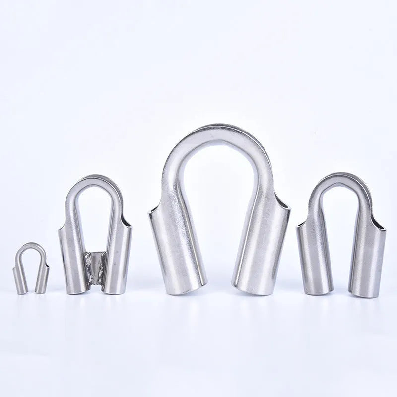 Stainless steel tubular chicken heart ring round sleeve ring set on a workshop surface