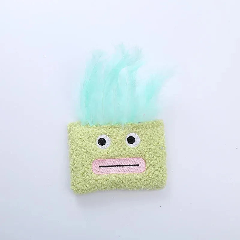 A funny big mouth explosion head shaped catnip plush toy shown in blue, green, orange, and purple colours.