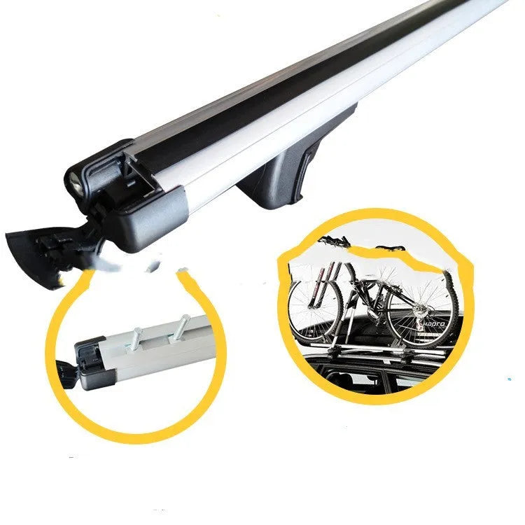 A pair of alloy roof rack crossbars for a General Motors SUV on a vehicle roof.