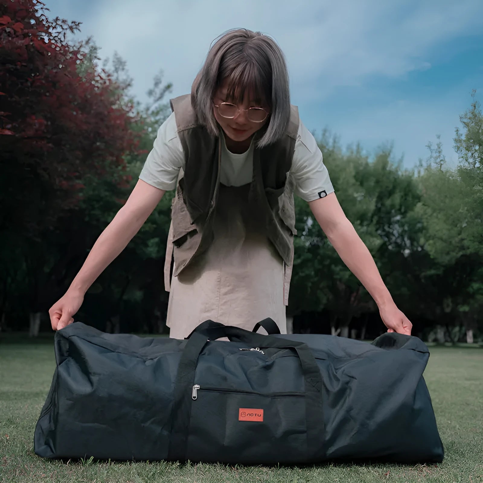 Blue waterproof storage bag for folding camping tables and chairs with 100L or 150L capacity options
