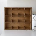 Square solid wood cup storage rack with multiple grid compartments in birch meridian colour finish