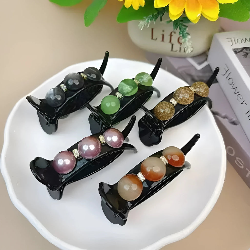 Acrylic pea barrette hair clip for women in green, shown against a dark background