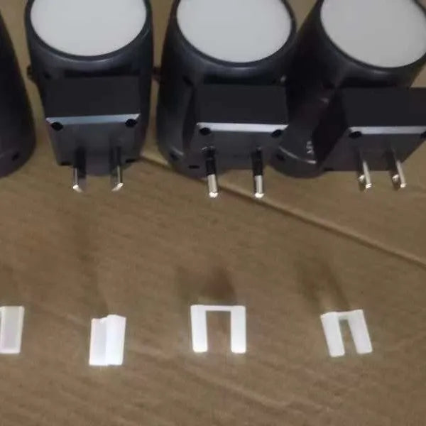 Direct plug night lamp with adjustable brightness control and rotatable head showing compact design
