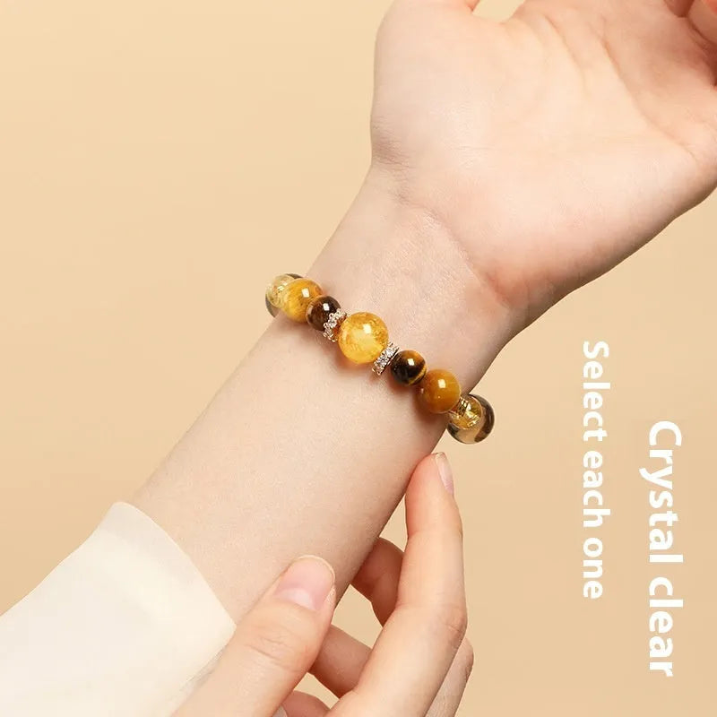 Tiger-eye crystal bracelet with Jinba symbol and geometric tower design in natural yellow