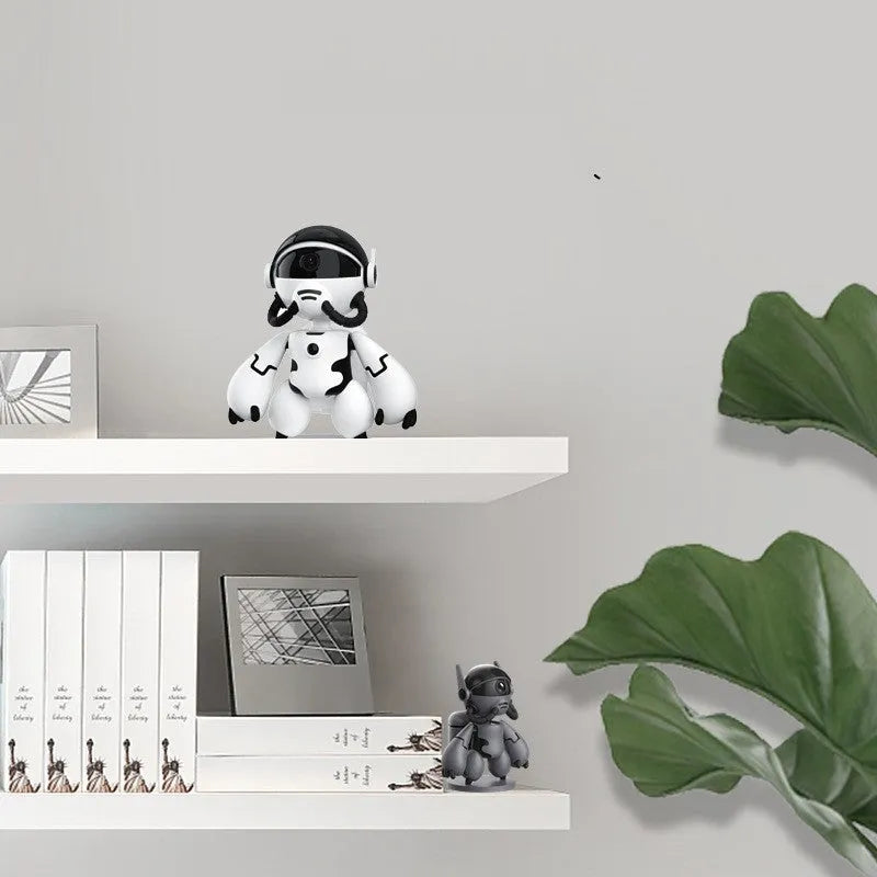 White indoor security camera with detachable base on a table